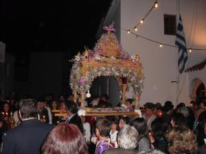 a crowd of people standing in front of a altar at The Boulas Rooms in Megalochori