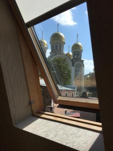 a view of a building from a window at Vesta Guest House in Kislovodsk