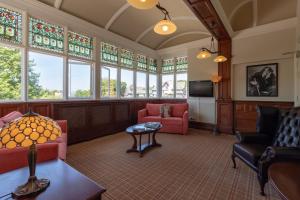 a large living room with stained glass windows at Windermere Park inc Free off-site Health Club in Windermere