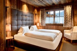 Voodi või voodid majutusasutuse Promi Alm Flachau - Luxus Chalets toas +37 fotot