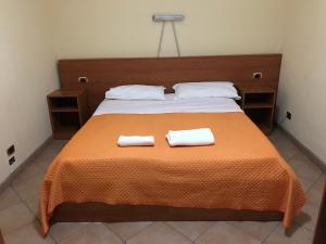 Tempat tidur dalam kamar di Hotel Bucolia
