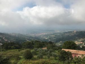 a view of a valley from a hill with a house at Hotel Bucolia in Lamezia Terme