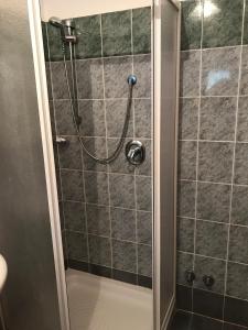 a shower with a hose in a bathroom at Hotel Bucolia in Lamezia Terme