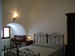 Postel nebo postele na pokoji v ubytování Masseria Cassiere