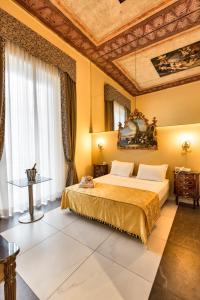 Кровать или кровати в номере Hotel Art Resort Galleria Umberto