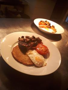 two plates of breakfast food on a table at Avenue House in Bakewell