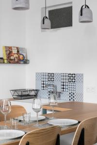 TV a/nebo společenská místnost v ubytování L'Aurore by Cocoonr + 6 fotografií