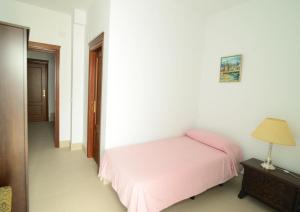 A bed or beds in a room at New Andalusian House 33 Free Private Parking