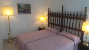 A bed or beds in a room at New Andalusian House 33 Free Private Parking