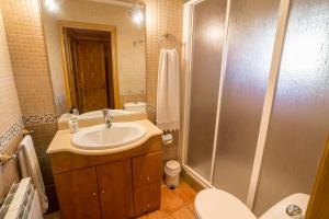 a bathroom with a sink and a shower at Casa Rural Cañón de Río Lobos II in Casarejos +20 photos