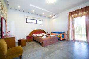 Ένα ή περισσότερα κρεβάτια σε δωμάτιο στο Iridanos Villa +19 φωτογραφίες