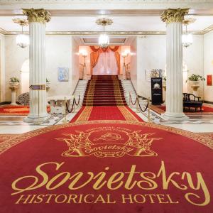 a large red rug with the words syracuse international hotel at Legendary Hotel Sovietsky in Moscow