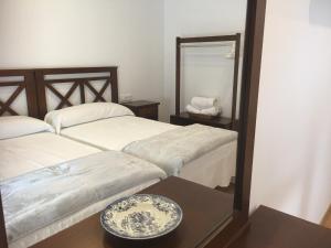 מיטה או מיטות בחדר ב-La Casa del Hilario