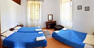 A bed or beds in a room at Nymph