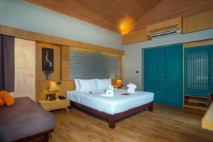 Postel nebo postele na pokoji v ubytování Weekender Resort