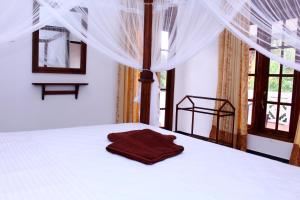 Postel nebo postele na pokoji v ubytování Amal Guest house