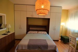 A bed or beds in a room at Studio Silva 2