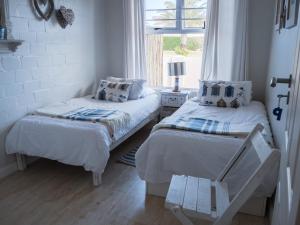 Ένα ή περισσότερα κρεβάτια σε δωμάτιο στο Watersedge Langebaan