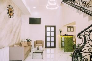 a living room with a couch and a table at Bolero plus in Mukacheve