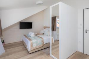 Posteľ alebo postele v izbe v ubytovaní Mediterra Residence