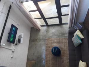 an overhead view of a room with a clock on the wall at Entire Industrial-Style Loft in Maboneng in Johannesburg