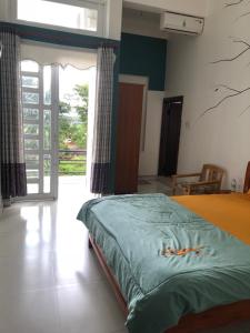 Postel nebo postele na pokoji v ubytování An Ngọc Linh Hotel