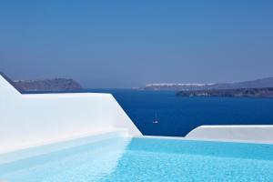 a swimming pool with a view of the water at Phos The Boutique in Akrotiri