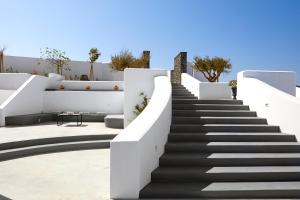 a set of stairs leading up to a house at Phos The Boutique in Akrotiri