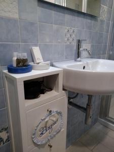a bathroom with a sink and a mirror and a sink at Il Vicolo 48 in Pesaro +70 photos