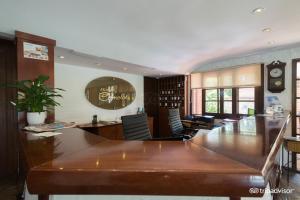 a large dining room with a large wooden table at Hotel Camelot in Punta del Este