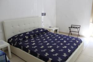 Łóżko lub łóżka w pokoju w obiekcie La Melagrana