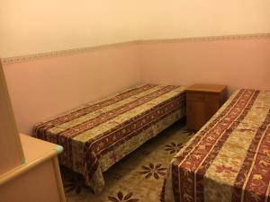 Posteľ alebo postele v izbe v ubytovaní Mar Ionio Apartment