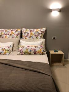 A bed or beds in a room at Giader's House - Free Parking