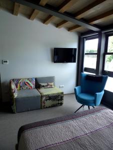 Televízia a/alebo spoločenská miestnosť v ubytovaní Blanco Apartamentos Turísticos