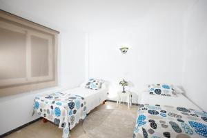 Posteľ alebo postele v izbe v ubytovaní Tabaiba Sea Views Apartment II