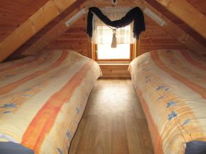 Postel nebo postele na pokoji v ubytování Sjónarholl Cottage
