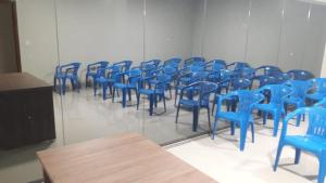 a group of blue chairs in a room at Planalto Palace Hotel in Rurópolis