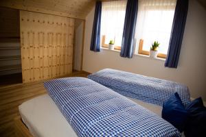 Postel nebo postele na pokoji v ubytování Ferienhaus Schleinzer