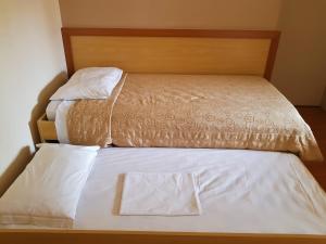 Postel nebo postele na pokoji v ubytování Omega Flat