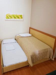 Postel nebo postele na pokoji v ubytování Omega Flat