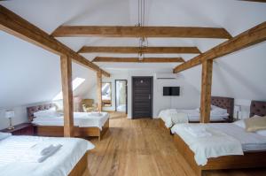 Postel nebo postele na pokoji v ubytování Apartamenty Mieszczańskie u Gołębiewskich
