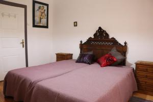 Un pat sau paturi într-o cameră la Solar dos Avós