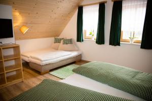 Postel nebo postele na pokoji v ubytování Ferienhaus Schleinzer