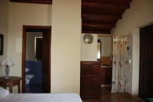 Postel nebo postele na pokoji v ubytování B&B La Casetta degli Aranci