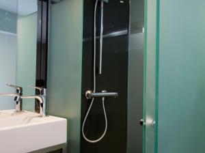 a bathroom with a shower and a sink at The Z Hotel Liverpool in Liverpool +23 photos