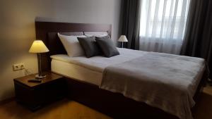 Posteľ alebo postele v izbe v ubytovaní Soprano Apartment Tamanska