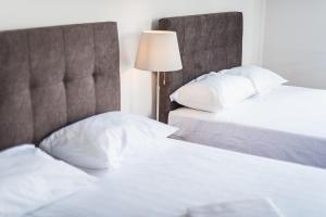 Posteľ alebo postele v izbe v ubytovaní Victoria Majesty Apartments