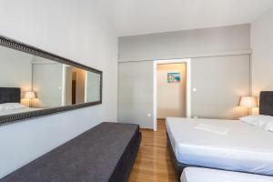 Posteľ alebo postele v izbe v ubytovaní Victoria Majesty Apartments