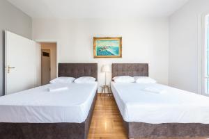 Posteľ alebo postele v izbe v ubytovaní Victoria Majesty Apartments