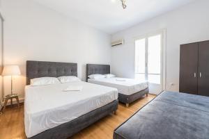 Posteľ alebo postele v izbe v ubytovaní Victoria Majesty Apartments